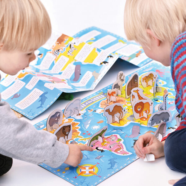 World map with poster and animal figures - What in the World Animals Around the World 4+